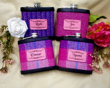 Four personalised bridesmaid's flasks with names