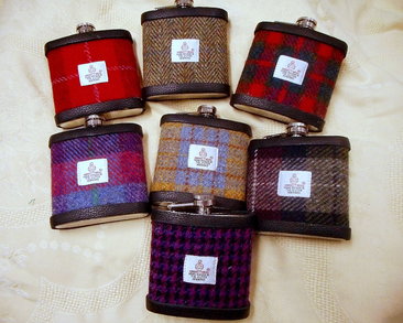 Set of seven Harris Tweed flasks