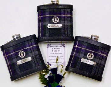 Hebridean Thistle tartan with custom engraved stainless steel tags and thistle