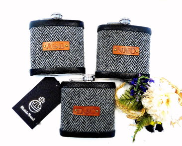 Three flasks with initials