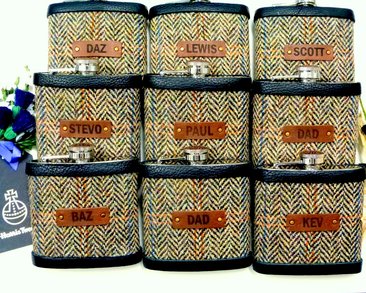 Set of Nine flasks with individual names on leather