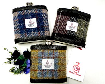 Set of three Harris Tweed flasks