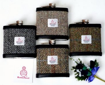 Set of four Harris Tweed flasks
