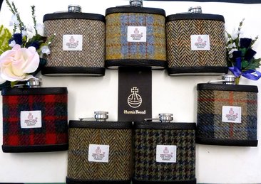 Set of seven Harris Tweed flasks