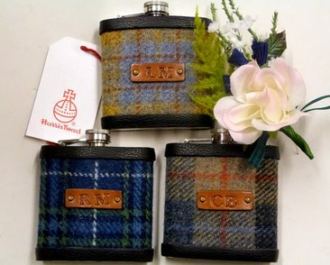 Three Harris Tweed flasks with brown hand embossed leather labels