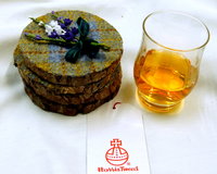 Log slice coasters with Harris Tweed in Blue, mustard yellow and russet plaid, ideal gift handmade in Scotland
