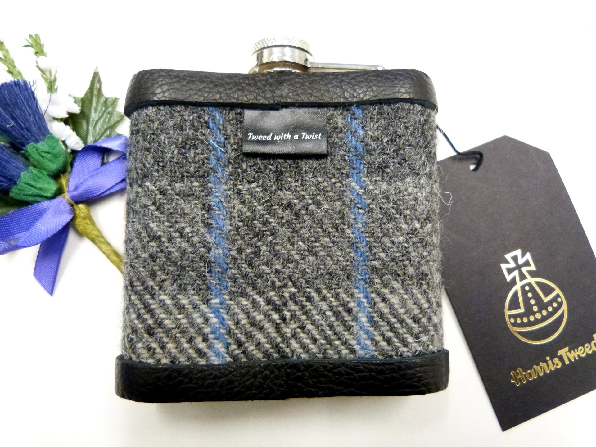 Harris Tweed hip flask in in silver grey, dark grey with blue detail plaid