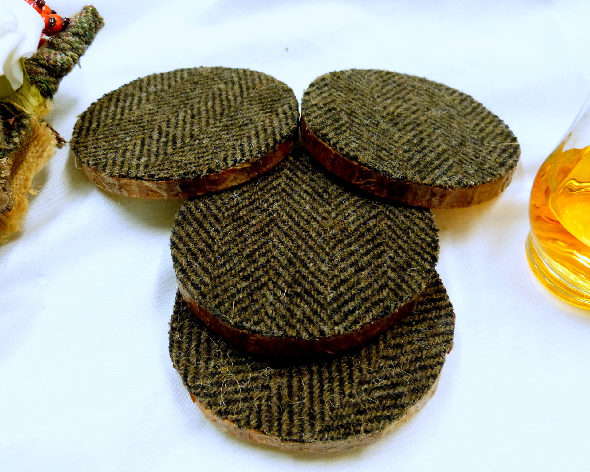Log slice Harris Tweed rustic drinks coasters, set of four brown herringbone handmade with natural pine wood and pure wool tweed