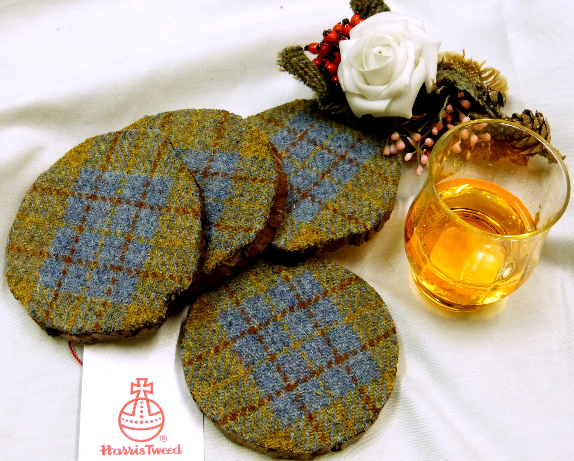 Log slice coasters with Harris Tweed in Blue, mustard yellow and russet plaid, ideal gift handmade in Scotland