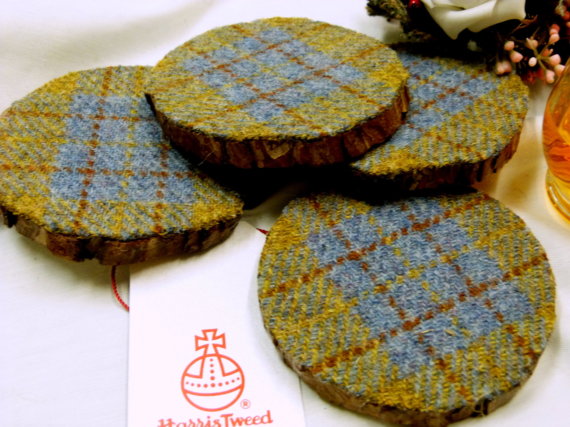 Log slice coasters with Harris Tweed in Blue, mustard yellow and russet plaid, ideal gift handmade in Scotland