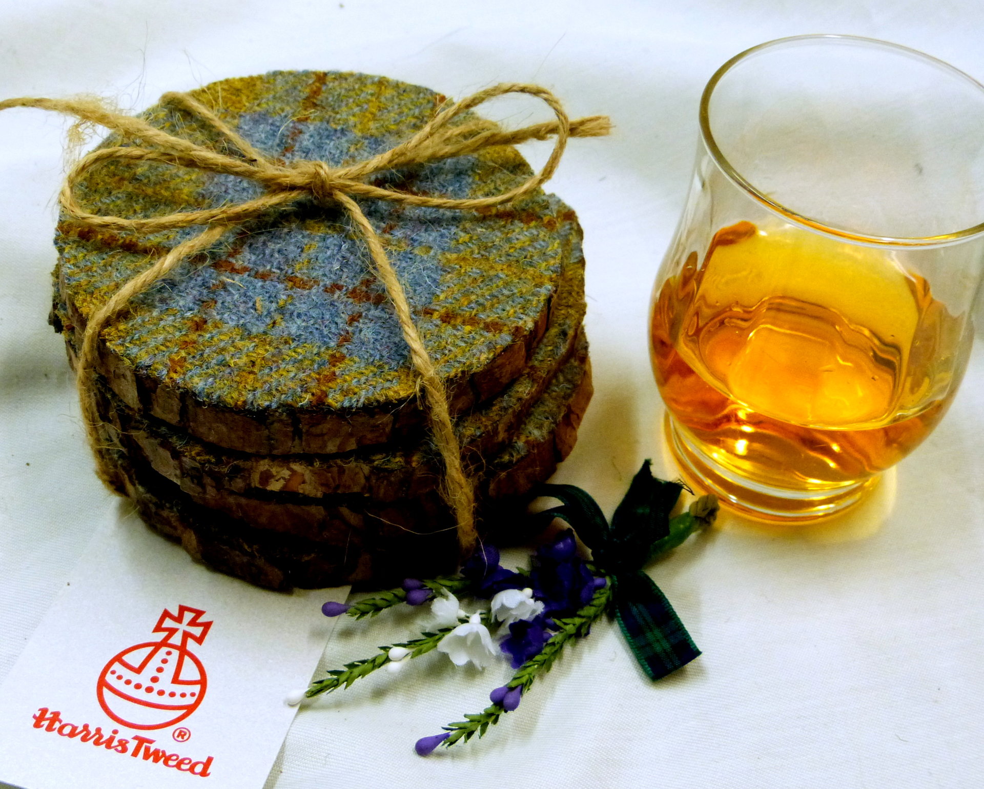 Log slice coasters with Harris Tweed in Blue, mustard yellow and russet plaid, ideal gift handmade in Scotland