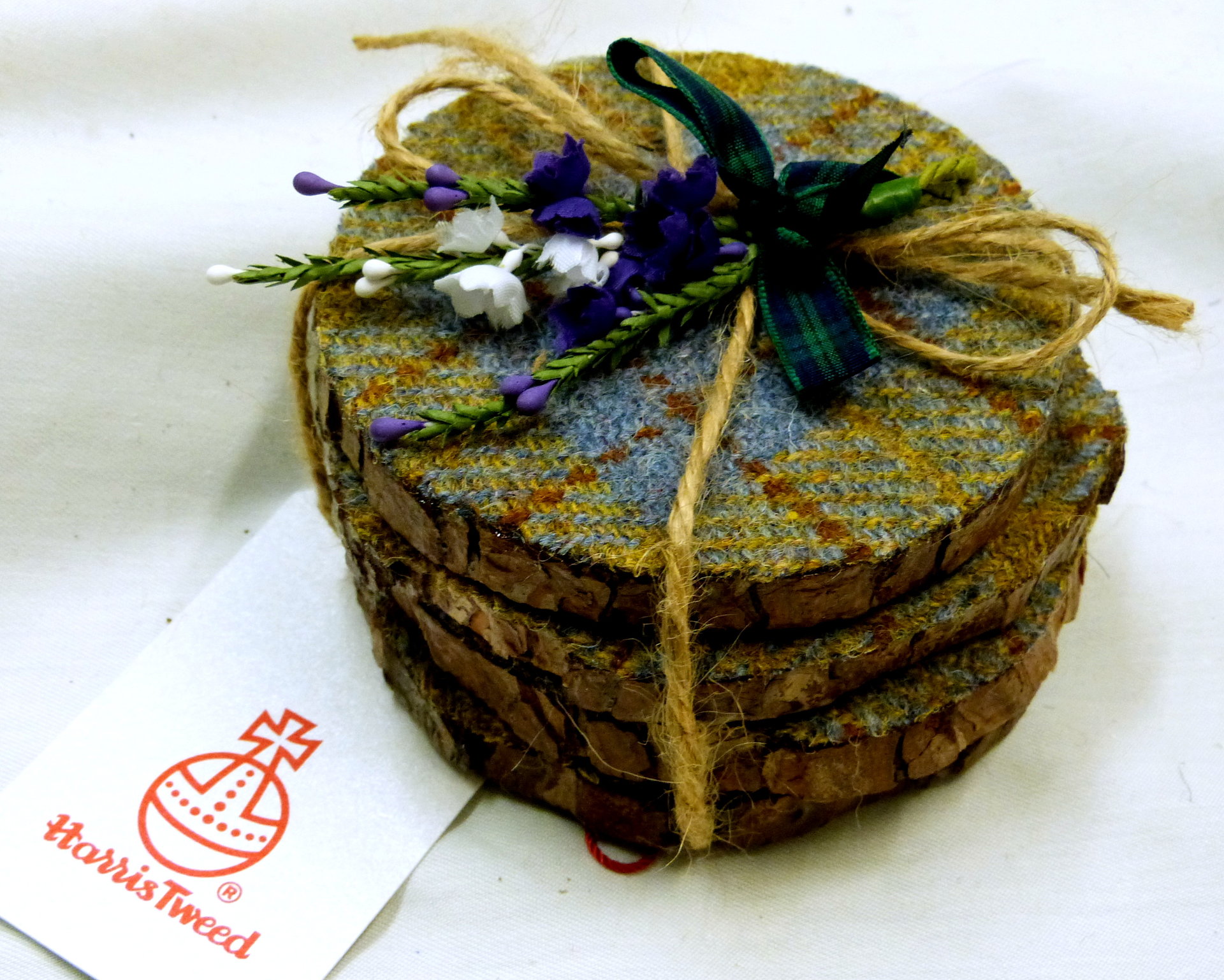 Log slice coasters with Harris Tweed in Blue, mustard yellow and russet plaid, ideal gift handmade in Scotland